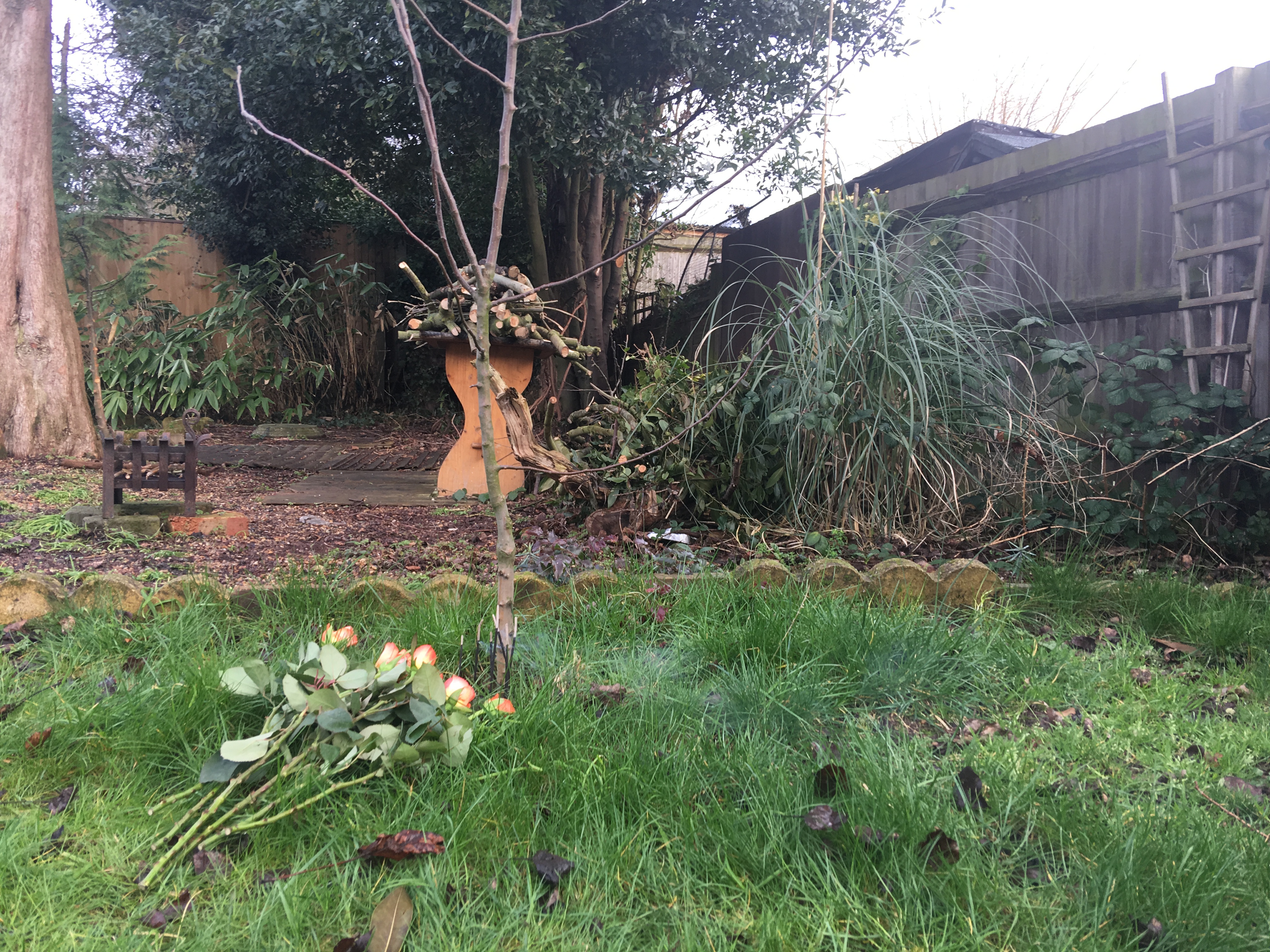 Flowers and incense sticks in his memory